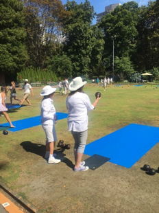 Pair of people lawn bowling