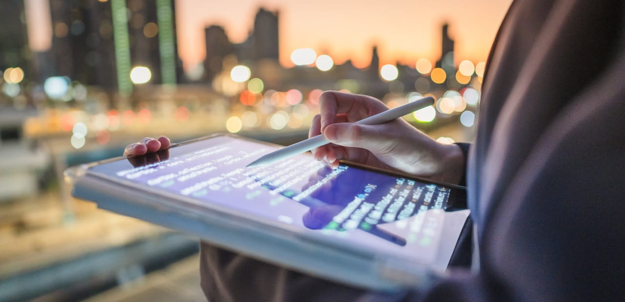 Modern generation Y business woman using Chatbot on tablet.